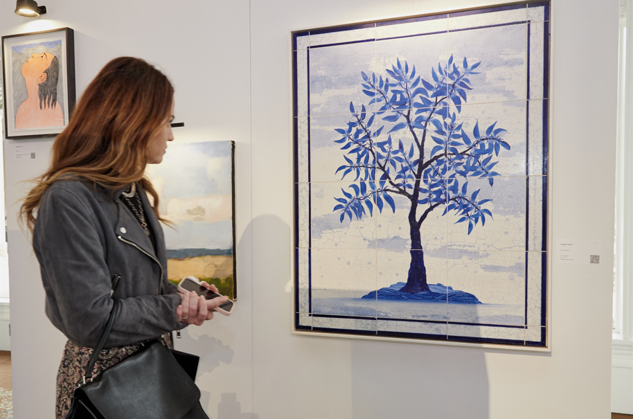 Woman looking at art on a wall