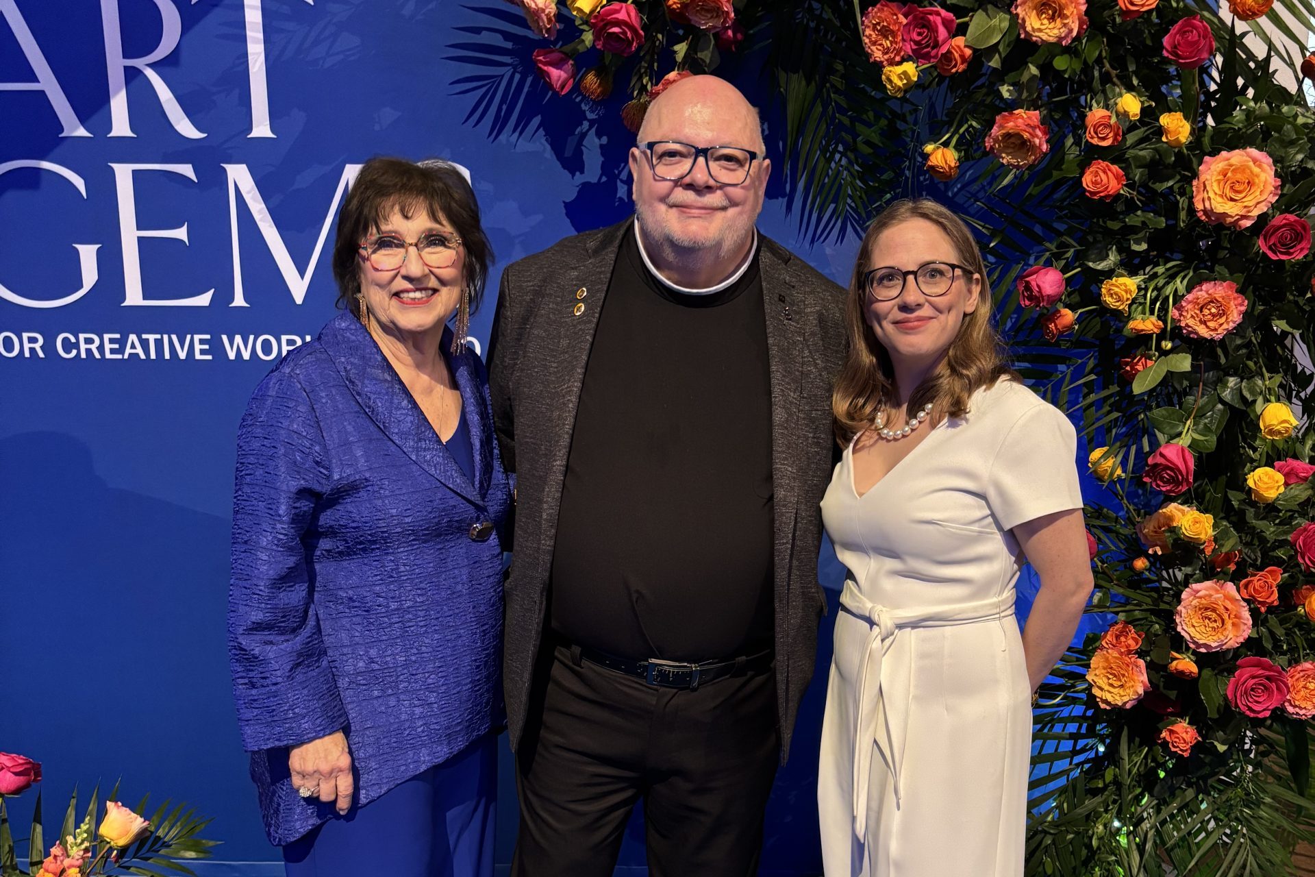 Three people at an Art Gems event